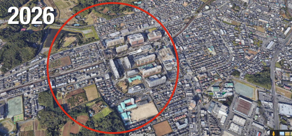 2026年の地域の上空写真、住宅地や商業施設が広がっている。